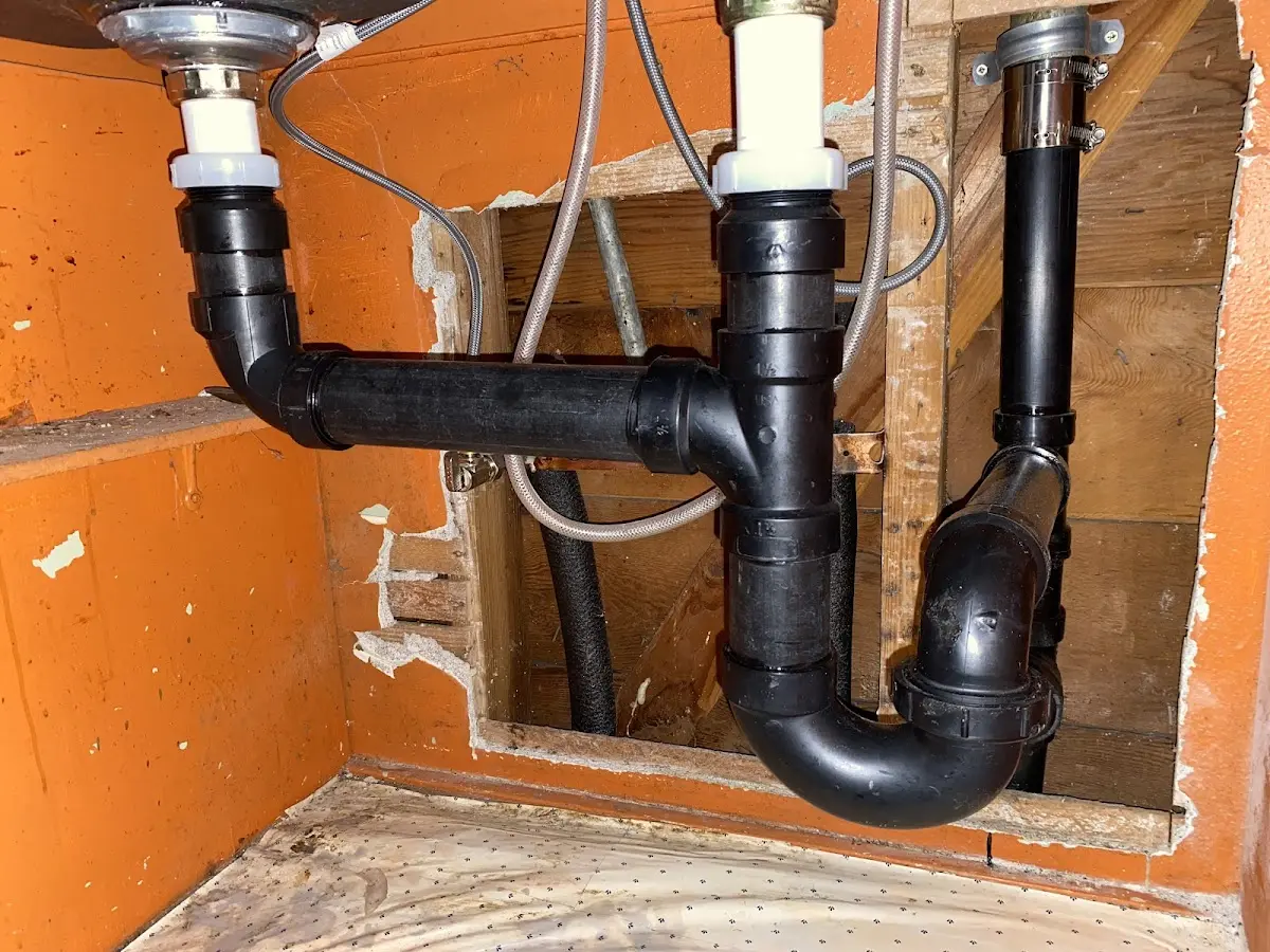 Professional Garbage Disposal Repair equipment and tools on the job in Highgate